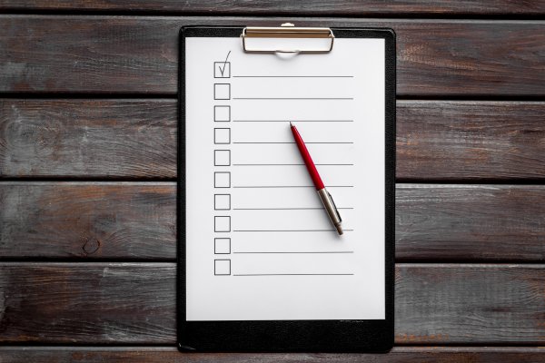 us search background check service cost price plans blank piece of paper and red pen boxes unchecked